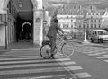 Healthy businessman in suit makes city trip by bike