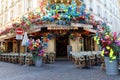 Le Bon Pecheur is corner cafe decorated with flowers. It located near the district of Chatelet in 1st district of Paris Royalty Free Stock Photo