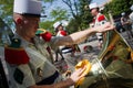 Paris, France - July 14, 2011. Legionnaire musician preparing his instrument before the parade on the Champs Elysees