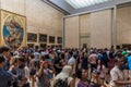 Paris, France - July 6, 2018: Mona Lisa at the Louvre Museum. Tourists photographing the famous picture of Gioconda in Louvre Royalty Free Stock Photo