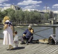 Old man playing violin at Pont des Arts - The Love Lock Bridge. Royalty Free Stock Photo