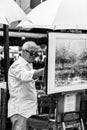 The painter works at the Tertre Square Place du Tertre in Mont