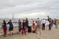 People and tourists looking at Paris rooftops view and Eiffel Tower from Galeries Lafayette terrace