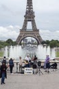 Paris, France - July 06, 2022: The sect of Jesus Christ gives a musical concert against the backdrop of the Eiffel Tower