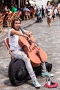 Street musician is playing cello outdoor in the Montmartre district. Paris, France Royalty Free Stock Photo