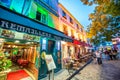 Paris, France - July 22, 2014: Tourists enjoy the evening in Montmartre, the famous artist quarter