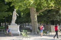 Tourists near Sculptural composition in the Tuileries Garden in Paris Royalty Free Stock Photo