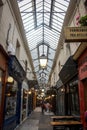 Parisian covered passage, passage des panoramas with typical retro signs of shops and boutiques.