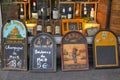 Wine shop with old and funny blackboard with wine prices in Paris, France