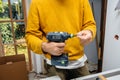 Male worker holding in hand Cordless drill T 18 plus 3 C 3,1-Plus