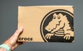 Crocs shoes cardboard box gray background