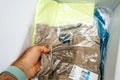 Man hand unboxing unpacking Nike Sport clothes