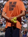 Ball boy holds Wilson Roland Garros tennis ball at Le Stade Roland Garros in Paris, France. Wilson is an Official Partner