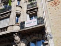 A banner is displayed on a balcony