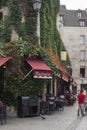 Paris, France - June 25, 2022: Cafe with a terrace in Paris. Royalty Free Stock Photo