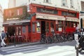 PARIS, FRANCE - JUNE 14, 2022: Cafes and restaurants with a terrace on the street in Paris Royalty Free Stock Photo