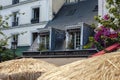 PARIS, FRANCE - JUNE 14, 2022: Cafes and restaurants with a terrace on the street in Paris Royalty Free Stock Photo