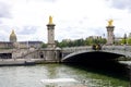 PARIS, FRANCE - JUNE 6, 2022: Detail of Pont Alexandre III Bridge with Les Invalides complex buildings on the background Royalty Free Stock Photo