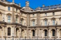 PARIS, FRANCE - JUNE 23, 2017: Details of the facade of the Louvre. Is the world largest art museum and is housed in the Louvre Royalty Free Stock Photo