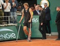 Injured tennis player Alexander Zverev of Germany enters court on crutches after his semi-final match against Rafael Nadal Royalty Free Stock Photo