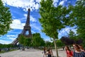 Paris, France, June 2022. In the large gardens of the Champ de Mars people relax in the greenery enjoying the view of the Eiffel