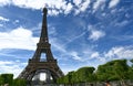 Paris, France, June 2022. In the large gardens of the Champ de Mars people relax in the greenery enjoying the view of the Eiffel