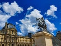 Paris, France, June 2019: Louvre Museum and Louis XIV statue