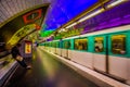 Paris, France - June 1, 2015: Metropolitain subway metro station, train rapidly passing by platform with cool neon Royalty Free Stock Photo