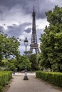 Old traditional lamp post pillar with Eiffel Tower in background in Paris