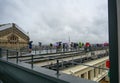 Paris, France, June 2022. The panoramic terrace of Galeries Lafayette on a rainy day: tourists do not give up enjoying the Royalty Free Stock Photo