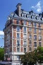 PARIS, FRANCE - June 14, 2022: Parisian residential buildings. Architecture of old Paris, beautiful facade, typical french houses