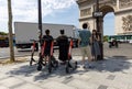 Paris, FRANCE - June 27, 2019: people with Lime electric scooters, rented through a mobile app and dropped off anywhere Royalty Free Stock Photo