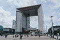 PARIS, FRANCE - JUNE 27, 2016: People walk in front of Grand Arche in La Defense, commercial, business district of the city. Urban Royalty Free Stock Photo