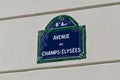 PARIS, FRANCE - JUNE 23, 2017: Plaque with the name of the famous french street Avenue des Champs-Elysees on the wall of an Royalty Free Stock Photo