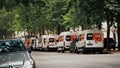 PARIS, FRANCE - JUNE 12, 2023. SIXT rental vans parked along the street