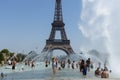 Paris, France, June 27, 2019: tourists and locals taking a bath in the Jardins du Trocad ro Guardians of the Trocadero under the