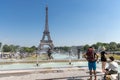 Paris, France, June 27, 2019: tourists and locals taking a bath in the Jardins du Trocad ro Guardians of the Trocadero under the
