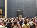 PARIS, FRANCE - JUNE 20: Tourists photographing the famous picture of La Gioconda in Louvre Museum on June 20th 2022 in