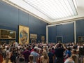 PARIS, FRANCE - JUNE 20: Tourists photographing the famous picture of La Gioconda in Louvre Museum on June 20th 2022 in