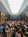 PARIS, FRANCE - JUNE 20: Tourists photographing the famous picture of La Gioconda in Louvre Museum on June 20th 2022 in