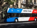 Open tour bus on Paris street