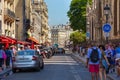 PARIS, FRANCE - JUNE 23, 2017: Tourists walking on the historic Rue du Cloitre-Notre-Dame street next to the famous Notre-Dame-de-