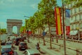 Paris, France - June 1, 2015: In traffic driving towards magnificent monument Arch of triumph