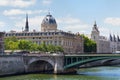 PARIS, FRANCE - JUNE 23, 2017: View of the bridge over the Seine river and Commercial Court of Paris building. It was built 1860