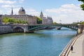 PARIS, FRANCE - JUNE 23, 2017: View of the bridge over the Seine river and Commercial Court of Paris building. It was built 1860