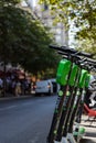 Paris, FRANCE - June 27, 2019: View of Lime electric scooters, rented through a mobile app and dropped off anywhere in the French Royalty Free Stock Photo