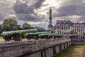 The war cannons at the entrance of the Invalides building and the Eiffel tower in the background