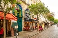 Paris, France - 24.04.2019: Latin Quarter. Narrow street of Paris among old traditional parisian houses and cafe in Royalty Free Stock Photo