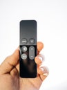 Man hand showing holding Apple TV 4k remote control white background