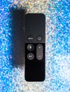 New Apple TV 4K remote control with Siri blue sparkle background